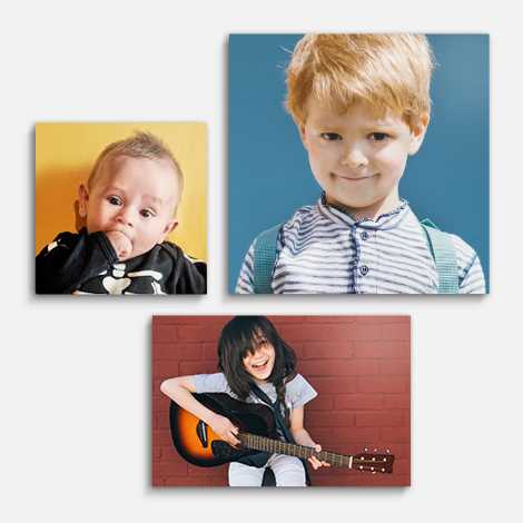 Snapfish Photo Tiles featuring a trio of child portraits displayed on a wall